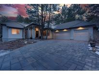 Stunning home exterior with a three-car garage and large driveway at 474 Silbrico Way, Castle Rock, CO 80108