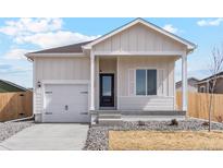 Charming single-Gathering home with a light exterior, a small front porch, and an attached one-car garage at 709 Twining Ave, Brighton, CO 80601