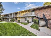 Charming condo complex with well-maintained lawn, mature trees, and individual balconies at 6495 E Happy Canyon Rd # 79, Denver, CO 80237