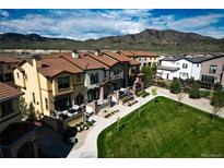 Beautiful townhomes feature red tile roofing and manicured lawns with stunning mountain views at 15576 W Washburn Cir, Lakewood, CO 80228