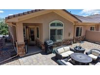 This outdoor patio boasts comfortable seating, a fire pit, and beautiful views at 6945 N Fargo Trl, Littleton, CO 80125