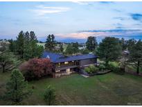 Expansive property with lush greenery and distant scenic views at 8092 Ponderosa Ln, Parker, CO 80138