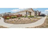 Charming single-Gathering home with a well-maintained yard, garden, and inviting curb appeal at 2122 Opal Ave, Brighton, CO 80603
