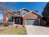 Charming two-story brick home with a well-maintained front yard and attached two-car garage at 3259 W 111Th Drive, Westminster, CO 80031