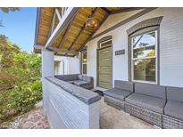 Inviting front porch with comfortable seating area and stylish design elements, perfect for relaxing outdoors at 3521 Osage St, Denver, CO 80211