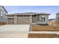 Charming single-Gathering home featuring a three-car garage and modern architectural details at 3906 N Irvington St, Aurora, CO 80019