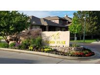 Community signage with stone and flower landscaping, welcoming you to Gold Peak at 8617 Gold Peak Dr # D, Highlands Ranch, CO 80130