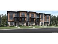New townhome with a landscaped yard, private balconies, and modern architecture in a desirable community at 835 Josephine Way, Superior, CO 80027