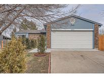 Cozy single-Gathering home with a white garage door and manicured front yard at 4234 S Bahama St, Aurora, CO 80013