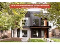 Modern two-story home with a manicured lawn and contemporary architectural details at 4322 Quivas St, Denver, CO 80211