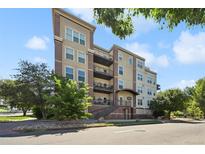 A charming apartment building with multiple balconies on a sunny day at 1780 N Washington St # 203, Denver, CO 80203