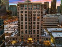 Luxury high-rise building with city views at sunset at 1827 N Grant St # 1000, Denver, CO 80203