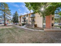 A charming two-story apartment building featuring multiple balconies and an inviting facade at 12113 Melody Dr # 304, Denver, CO 80234