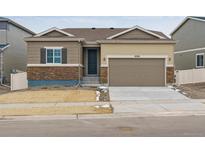 Charming single-Gathering home with a two-car garage and mixed stone and vinyl siding at 18308 Martinello Dr, Parker, CO 80134