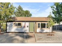 Charming single-story home with updated exterior, rock garden, and a well-maintained front yard at 3980 S Hazel Ct, Englewood, CO 80110