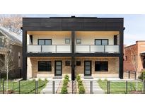 Modern two-story duplex with brick facade, black accents, and private balconies at 425 S Pearl St, Denver, CO 80209