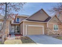 Inviting two-story home featuring a two car garage and charming curb appeal at 6068 W Utah Ln, Lakewood, CO 80232