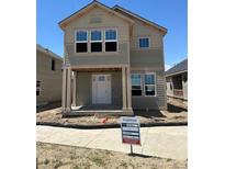 New two-story home boasts a welcoming front porch and modern design elements at 54 Waterford St, Erie, CO 80516