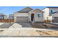 Charming single Gathering home featuring a two car garage and neutral-colored siding at 1392 Rock Cliff Ave, Erie, CO 80516