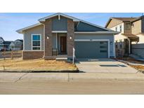 New construction home with attached garage and neutral color palette at 8124 Cokedale Cir, Littleton, CO 80125