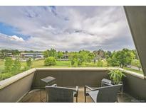 View from balcony showing a landscape with trees and a building in the distance at 3240 Iris Ave # G409, Boulder, CO 80301
