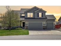 Charming two-story home with a well-maintained lawn and a three-car garage at 952 Eaglestone Dr, Castle Rock, CO 80104