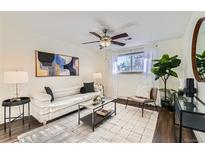 Bright living room with comfy seating, stylish decor, and hardwood floors at 1608 Cottonwood Dr # 4, Louisville, CO 80027