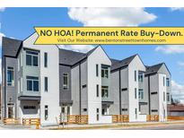 Modern townhome featuring a gray and white exterior, beautiful landscaping, and 'No HOA' promotion at 5367 W 14Th Ave, Lakewood, CO 80214