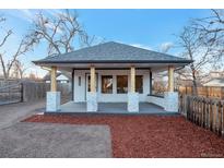 Newly renovated bungalow with modern facade, covered porch, and landscaped yard at 1765 Ingalls St, Lakewood, CO 80214