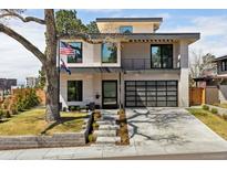 Stunning modern home with an attractive exterior, showcasing clean lines, a two-car garage, and an inviting entrance at 267 S Clermont St, Denver, CO 80246