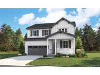 Charming two-story home boasts a covered porch, two car garage, and a beautifully landscaped front yard at 2656 Simpson Ln, Erie, CO 80026