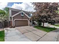 Charming two-story home with a two-car garage and well-maintained landscaping at 573 Entrada Dr, Golden, CO 80401