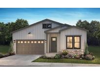 Charming single-story home with stone accents, a modern garage door, and a well-manicured lawn at 11106 Stonepath St, Littleton, CO 80125