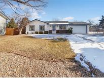 Charming single-story home featuring a manicured front yard with a two-car garage and lovely curb appeal at 1584 S Salem Cir, Aurora, CO 80012