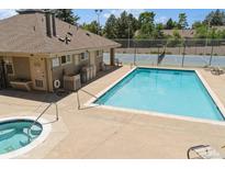 Enjoy this outdoor pool and tennis court on a sunny day at 11147 W 17Th Ave # 105, Lakewood, CO 80215