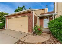 Charming brick home with attached garage and well-maintained landscaping at 11532 Newland St, Westminster, CO 80020