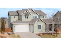 Charming two-story home with a two-car garage and manicured landscaping at 973 Treece St, Louisville, CO 80027