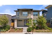 Modern two-story home with a well-manicured front yard and stylish architectural details at 5988 N Boston St, Denver, CO 80238