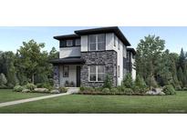 Two-story modern home with stone accents and a landscaped lawn at 960 Superior Dr, Superior, CO 80027