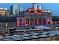 Striking evening view of the historic Union Station with its iconic neon sign and Denver skyline backdrop at 1750 Wewatta St # 1230, Denver, CO 80202