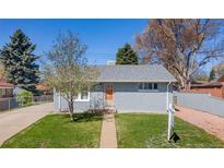 Charming single-story home with a well-manicured lawn and appealing curb appeal at 6981 Zuni St, Denver, CO 80221