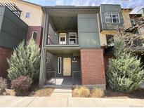 Contemporary townhome showcasing a brick facade and private balcony at 11267 Central Ct, Broomfield, CO 80021