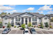 Attractive two-story condo with private balconies and stone accents at 875 E 78Th Ave # 52, Denver, CO 80229