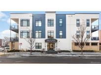Inviting Logan Lofts features modern blue and white facade with ample windows and outdoor living at 336 E 1St Ave # 209, Denver, CO 80203