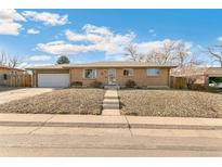 Charming brick ranch-style home with well-maintained front yard and inviting curb appeal at 6581 S Logan St, Centennial, CO 80121