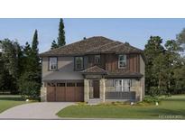 Charming two-story home featuring a mix of stone and wood siding, a welcoming porch, and an attached two-car garage at 15265 Fillmore St, Thornton, CO 80602