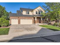 Charming two-story home with a three-car garage, well-kept lawn, and inviting curb appeal at 13018 Niagara Way, Thornton, CO 80602