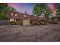 Spacious townhome with covered parking and ample parking spaces near mature trees at 1200 S Monaco St Pkwy # 31, Denver, CO 80224