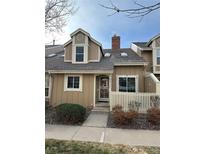 Charming two-story home with a cozy, inviting exterior, chimney, and trimmed in white at 9934 Grove St # C, Westminster, CO 80031