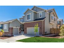 A beautiful two-story home showcases a brick facade and a two-car garage with an inviting curb appeal at 434 W 128Th Dr, Westminster, CO 80234